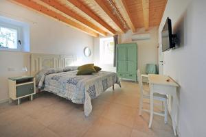 TV a/nebo společenská místnost v ubytování Agriturismo Corte Bonetti