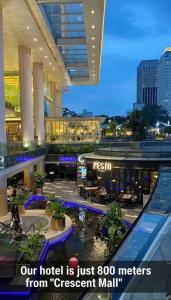 a hotel with a shopping mall with the words our hotel is just meters from at Baku Khatai Central Hotel in Baku