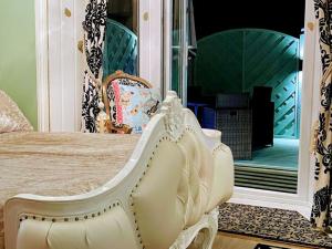 a bedroom with a bed and a large mirror at Spend a night in Paris whilst visiting Swansea in Swansea +5 photos