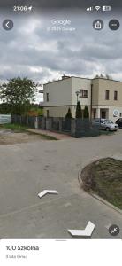 a picture of a parking lot with a building at Mieszkanie 3 pokojowe Marki in Marki