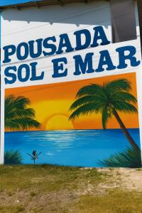 a sign for a pueblooiloiloiloiloil mat on a building at Ilheus - Pousada Sol e Mar in Ilhéus