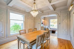 a dining room with a wooden table and chairs at Guestroom in Old Town | Steps to Lake & Everything in Niagara on the Lake +30 photos