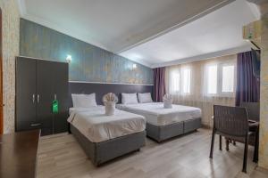 Postel nebo postele na pokoji v ubytování Istanbul Oldcity Apart