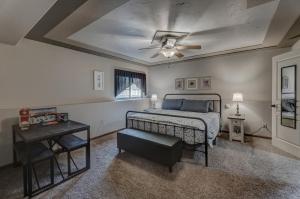 a bedroom with a bed and a ceiling fan at Just Like Home, Centrally Located Family Friendly! in Rapid City