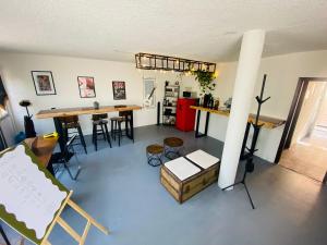a living room with a table and some chairs at Music Guest House in Mexico City +37 photos