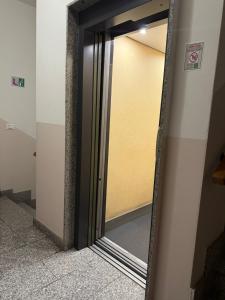 a mirror on the side of a room at RUS Apartment in Florence