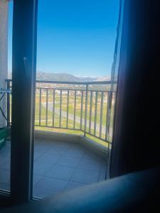a room with a balcony with a view at Great Deal in Podgorica
