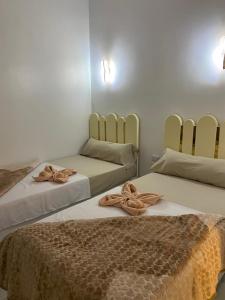 Postel nebo postele na pokoji v ubytování OBAI Nubian Guest House