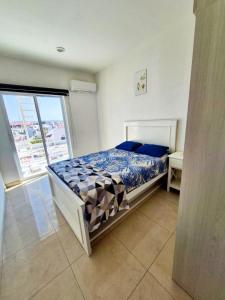 Ένα ή περισσότερα κρεβάτια σε δωμάτιο στο Malva Blanco Armonía 2 Min Malecón y Playas