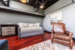 a living room with a couch and a chair at Long Beach Apartment - 10 Min Walk to the Beach! in Long Beach