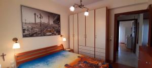 Ένα ή περισσότερα κρεβάτια σε δωμάτιο στο ILIADA Apartment