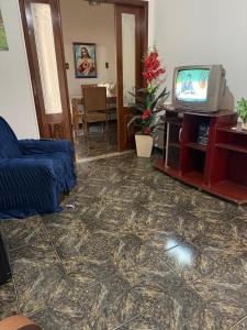 TV a/nebo společenská místnost v ubytování Casa de Temporada Piumhi