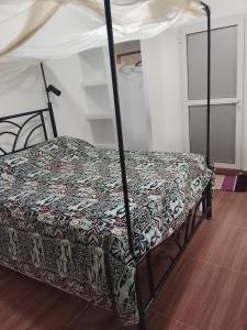 Postel nebo postele na pokoji v ubytování Villa keur Baye fall