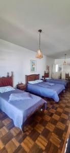 Postel nebo postele na pokoji v ubytování Casa José e Maria no Centro de Socorro + 26 fotografií