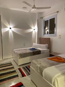 Postel nebo postele na pokoji v ubytování OBAI Nubian Guest House + 45 fotografií