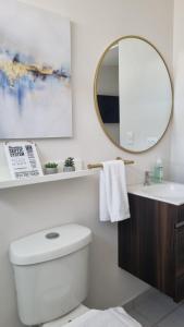 a bathroom with a white toilet and a mirror at Cozy House! San Miguel in San Miguel +40 photos