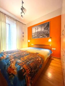 Ένα ή περισσότερα κρεβάτια σε δωμάτιο στο ILIADA Apartment