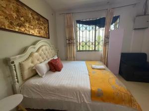 Postel nebo postele na pokoji v ubytování Huayun Primier Hotel