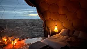 a room with a bed and a window with lights at Camp Boutique in Gaulverjabær +67 photos