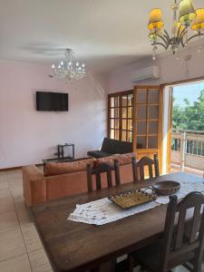 a living room with a table and a couch at La Bendita in Posadas