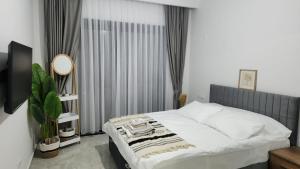 Un pat sau paturi într-o cameră la Caesar Resort Iskele Long Beach CORNELİUS 99