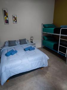 Postel nebo postele na pokoji v ubytování Parvis Magna HOSTAL