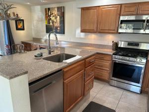 a kitchen with a sink and a stove at Rancho Mirage Gem! 90 day-bookings only in Rancho Mirage