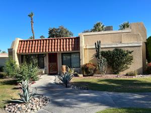 a house with a tile roof and a driveway at Rancho Mirage Gem! 90 day-bookings only in Rancho Mirage