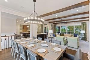a dining room and living room with a table and chairs at SS59: 59 Surfsong in Kiawah Island