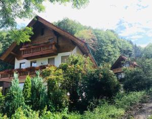 a house with a balcony on a mountain at Haus Sigmund in Waldhäuser