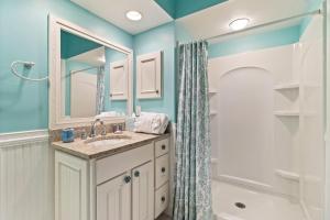 a bathroom with a sink and a shower at TP4937: 4937 Turtle Point in Kiawah Island +7 photos