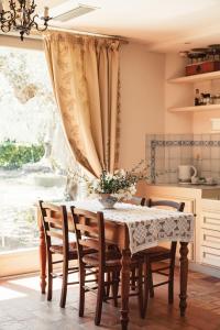 a dining room with a table and chairs and a window at Diana in Pesaro +32 photos