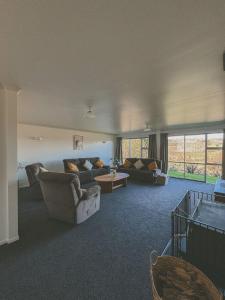 Et opholdsområde på Raglan Rural Retreats - The Homestead