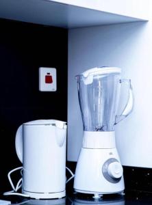 a blender sitting on top of a counter at Legacy Square Apartment in Accra