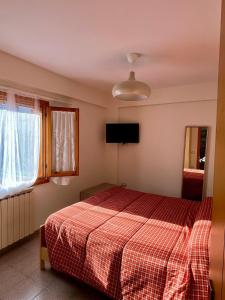 Postel nebo postele na pokoji v ubytování Maiella Experience - Bilocale in centro e piste sci