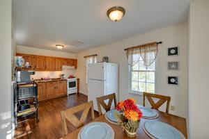 une cuisine avec une table et un réfrigérateur blanc dans l'établissement Walk to Wildwood Beach Family Retreat with Yard!, à Wildwood 16 autres photos