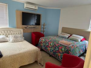 Ένα ή περισσότερα κρεβάτια σε δωμάτιο στο Recanto Luna Foz +106 φωτογραφίες