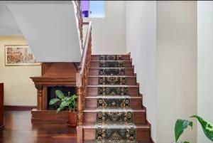 a spiral staircase with a potted plant on it at Arco-Íris in Canhas