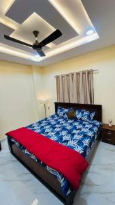 Ένα ή περισσότερα κρεβάτια σε δωμάτιο στο Elite Luxury Homestay