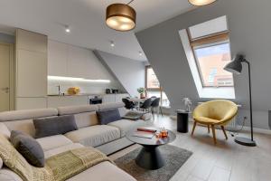 Et opholdsområde på Aura - Riverside & Parking by Downtown Apartments