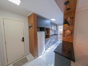 Kuchyň nebo kuchyňský kout v ubytování Apto a poucos metros do mar