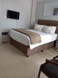 Ένα ή περισσότερα κρεβάτια σε δωμάτιο στο Durban Oceanic 82A