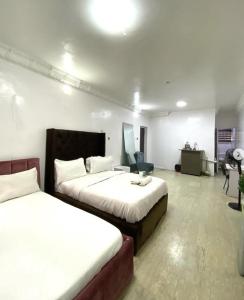 Postel nebo postele na pokoji v ubytování IlewaLekkiLagos