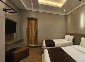 Ένα ή περισσότερα κρεβάτια σε δωμάτιο στο Hotel Plaza San Sebastian