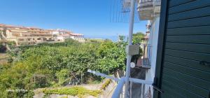 a view from the side of a building looking down a hill at Casa Marigé in San Nicola Arcella