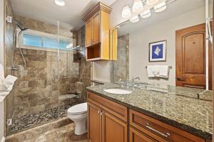 a bathroom with a sink and a toilet and a shower at FR480: 480 Fiddlers Reach in Kiawah Island +23 photos