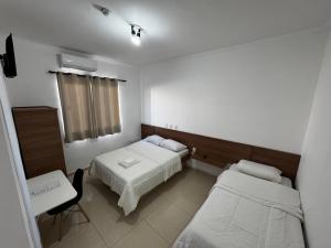 Ένα ή περισσότερα κρεβάτια σε δωμάτιο στο Hotel Gran Valle