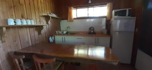 Kuchyň nebo kuchyňský kout v ubytování Cabañas Chilcos del Sur