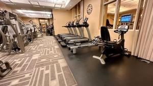 a gym with several treadmills and cardio machines at Private MGM Signature Studios in Las Vegas