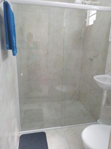 a shower with a glass door in a bathroom at Almar Maragogi in Maragogi +31 photos